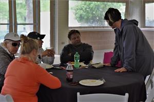 Lesa visiting with golfers